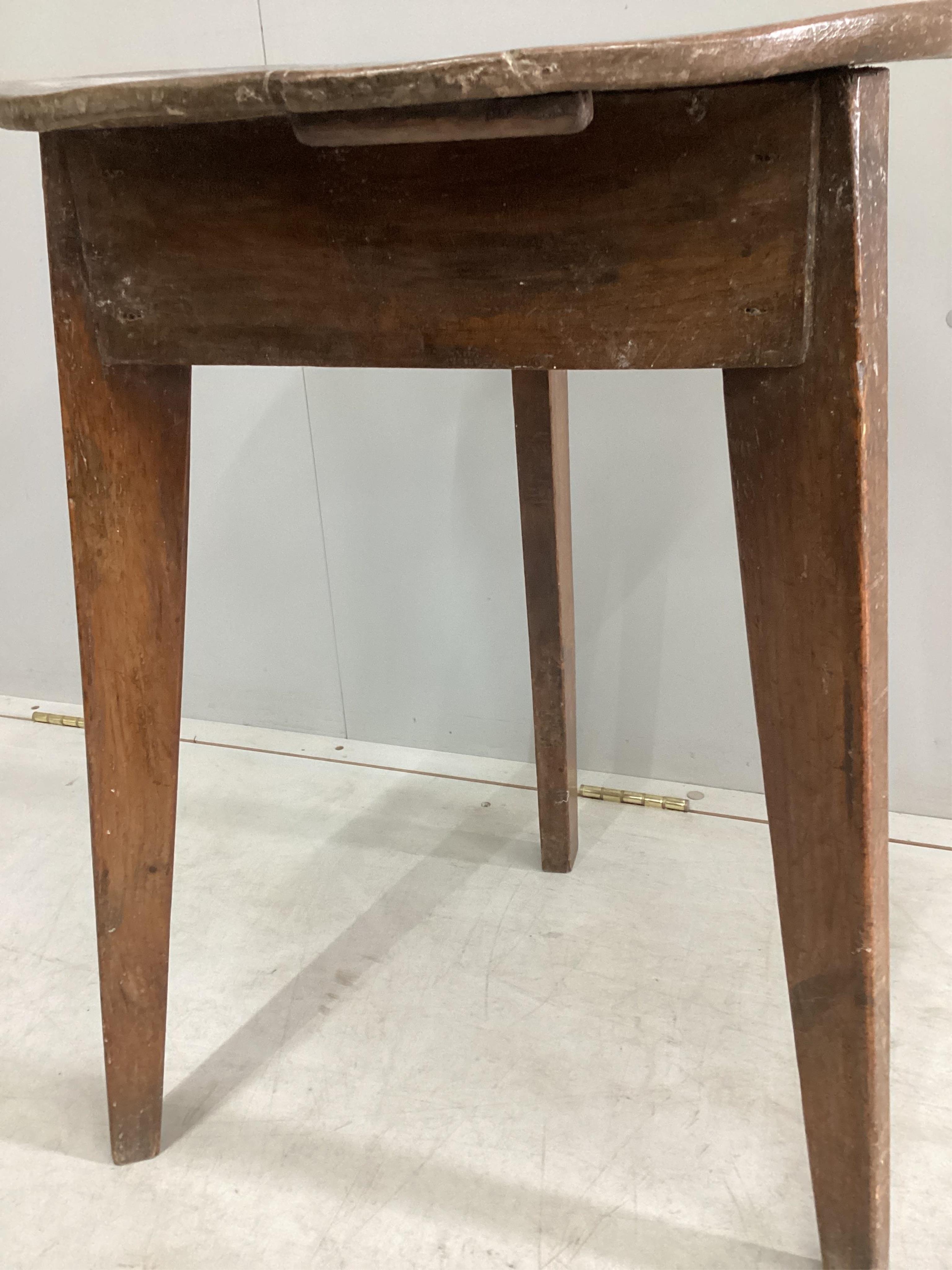 An early 19th century elm and fruitwood cricket table, diameter 46cm, height 66cm. Condition - fair